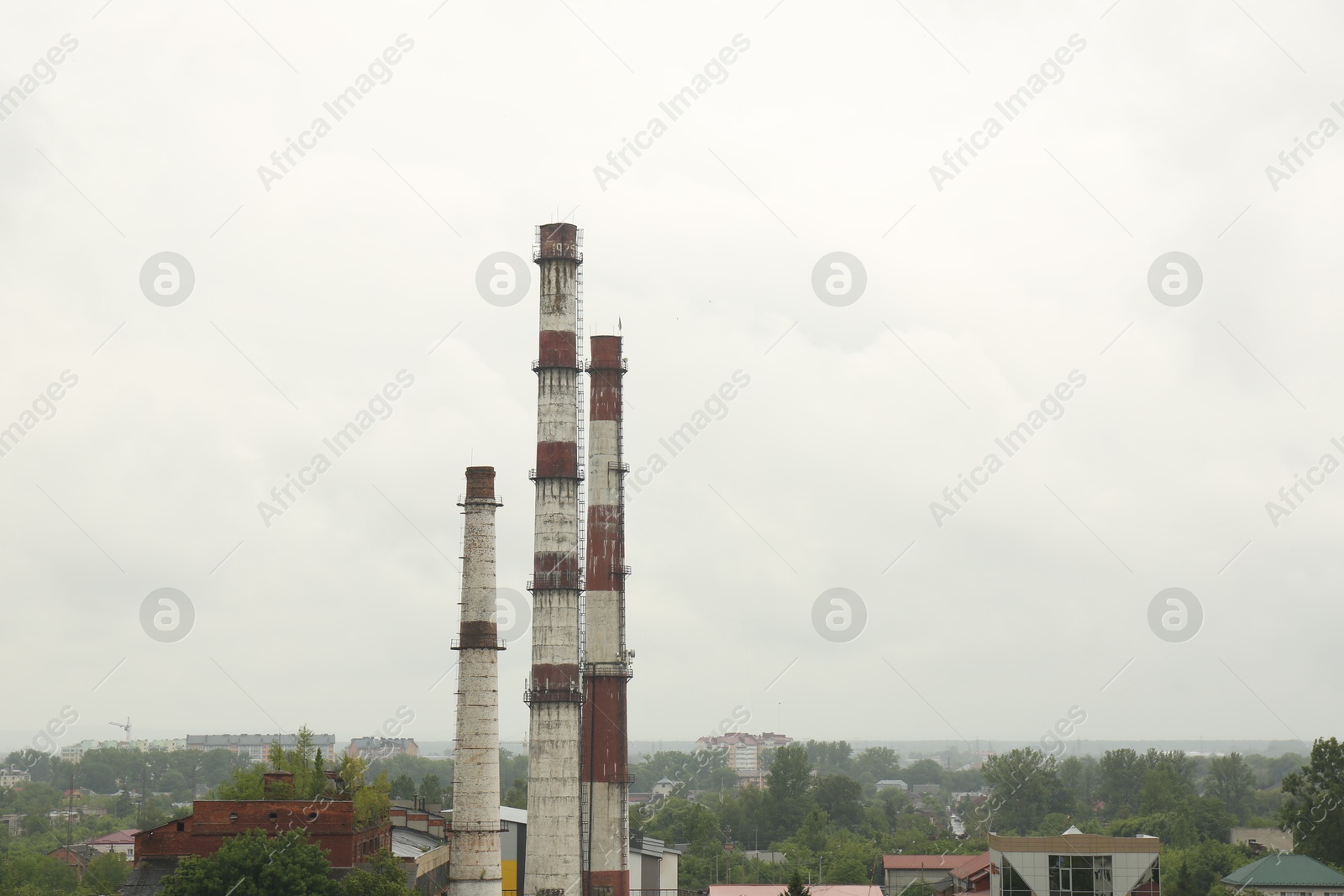 Photo of Modern power station in city on cloudy day, space for text