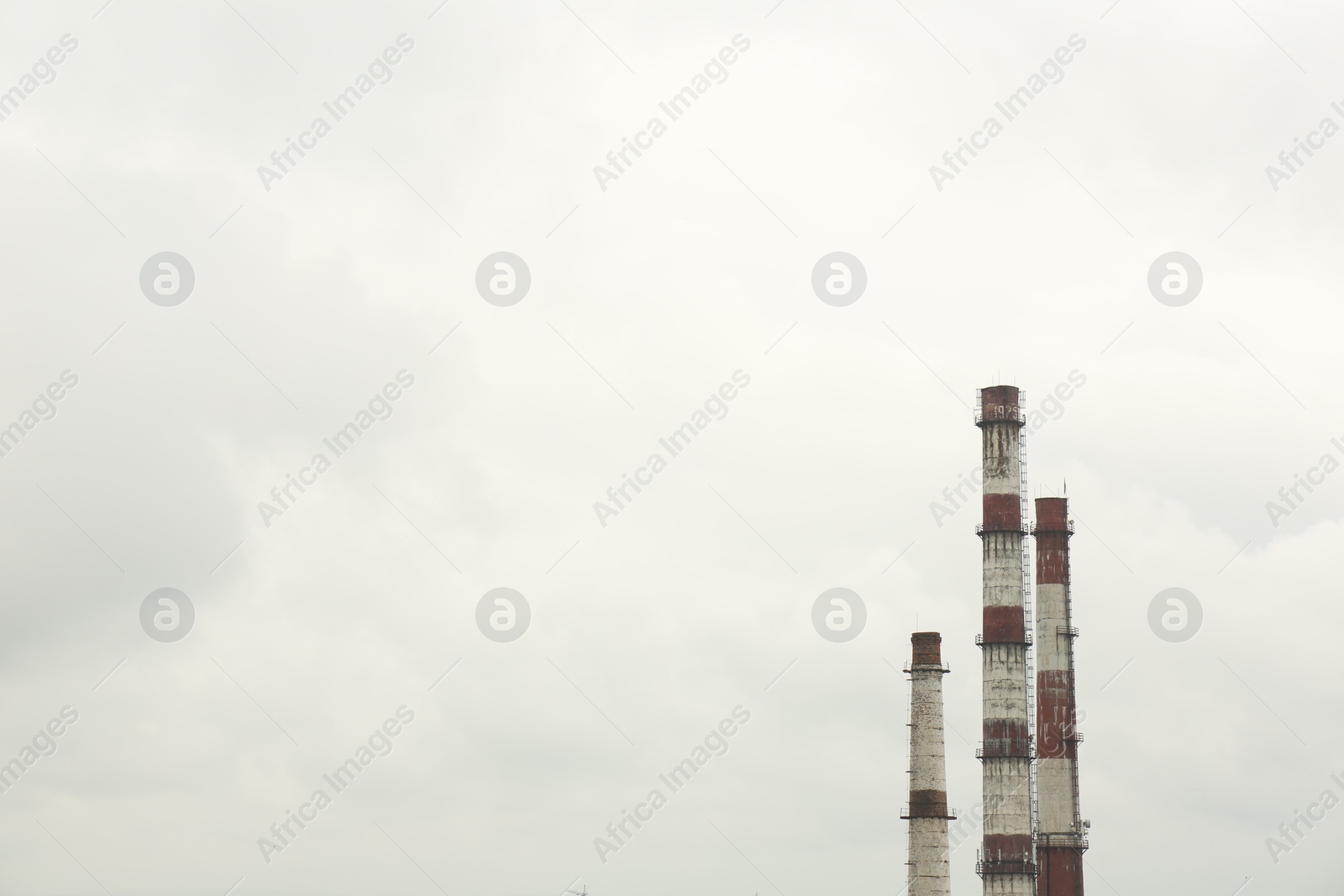 Photo of Modern power station against cloudy day, space for text