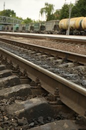 Metal railway lines outdoors in city, closeup view