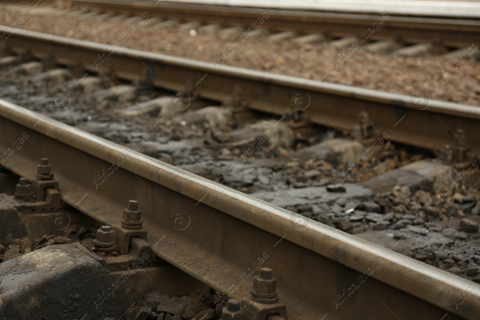 Photo of Metal railway lines outdoors in city, closeup view