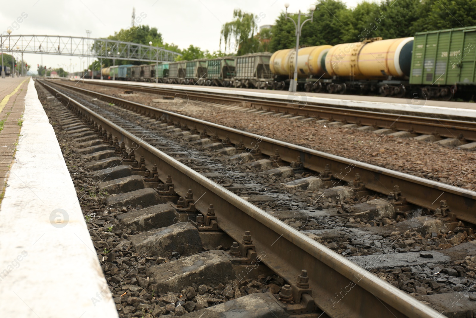 Photo of Metal railway lines outdoors in city, closeup view