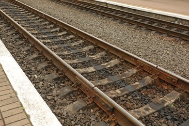 Metal railway lines outdoors in city, closeup view