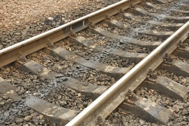 Photo of Metal railway lines outdoors in city, closeup view