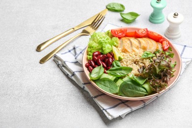 Photo of Healthy meal. Tasty vegetables, quinoa and chicken breast in bowl on white table, space for text