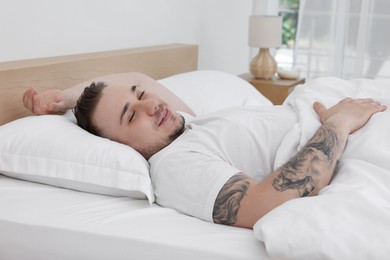 Bedtime. Handsome man sleeping in bed indoors