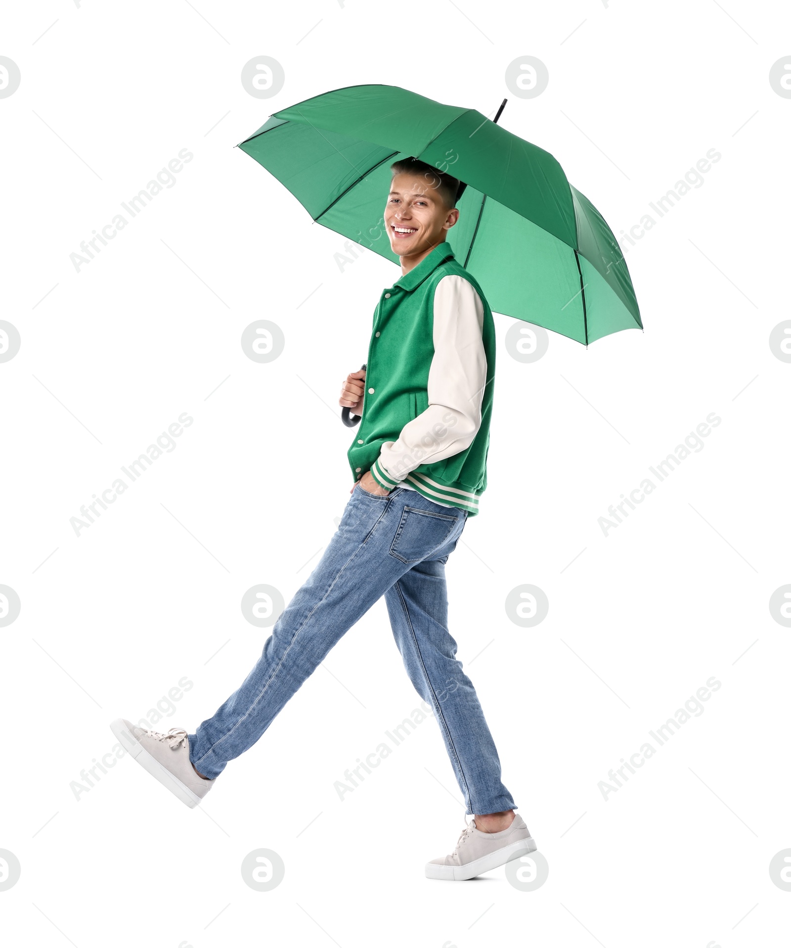 Photo of Young man with green umbrella on white background