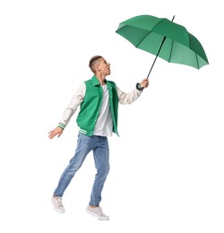 Young man with green umbrella on white background