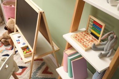 Different toys and furniture in child room