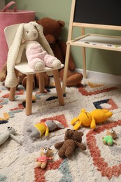 Stylish child room interior with different toys and furniture