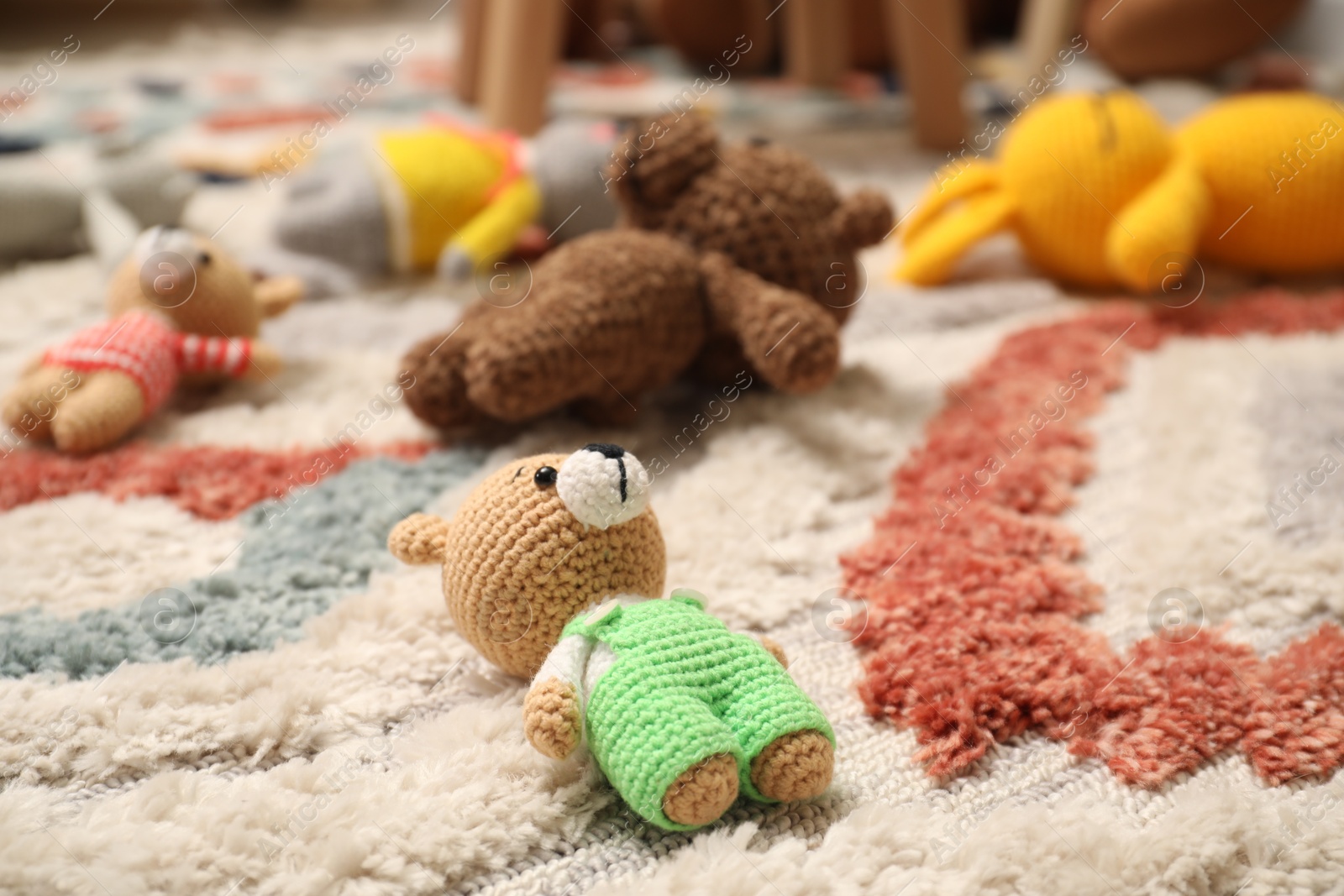 Photo of Different toys on soft carpet in child room