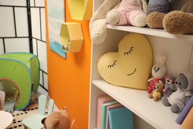 Different toys and furniture in child room