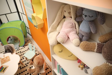 Different toys and furniture in child room