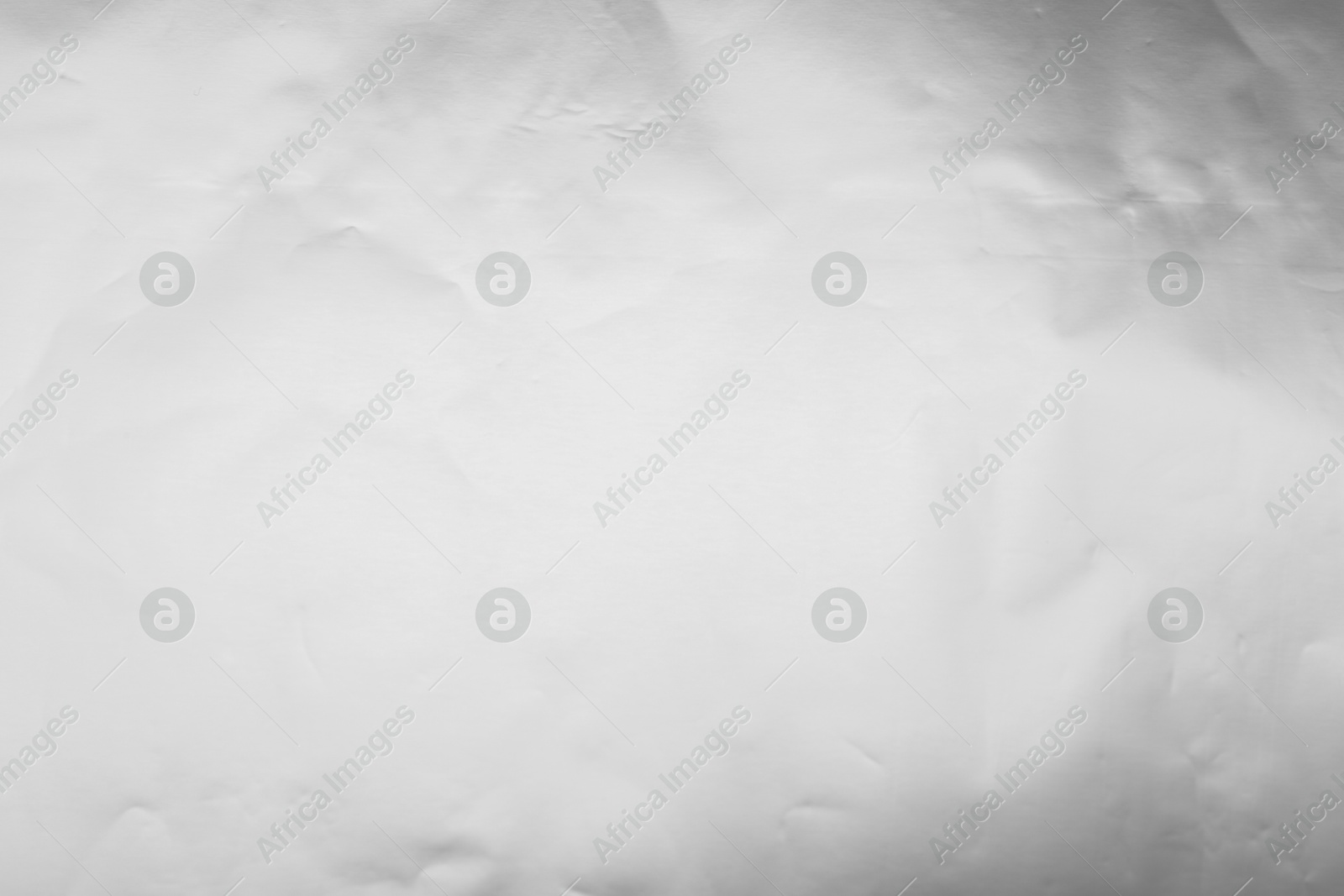 Photo of Shiny silver foil as background, top view