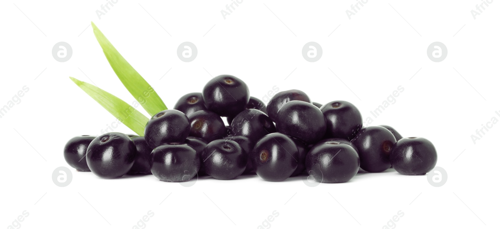 Photo of Fresh ripe acai berries and green leaves isolated on white