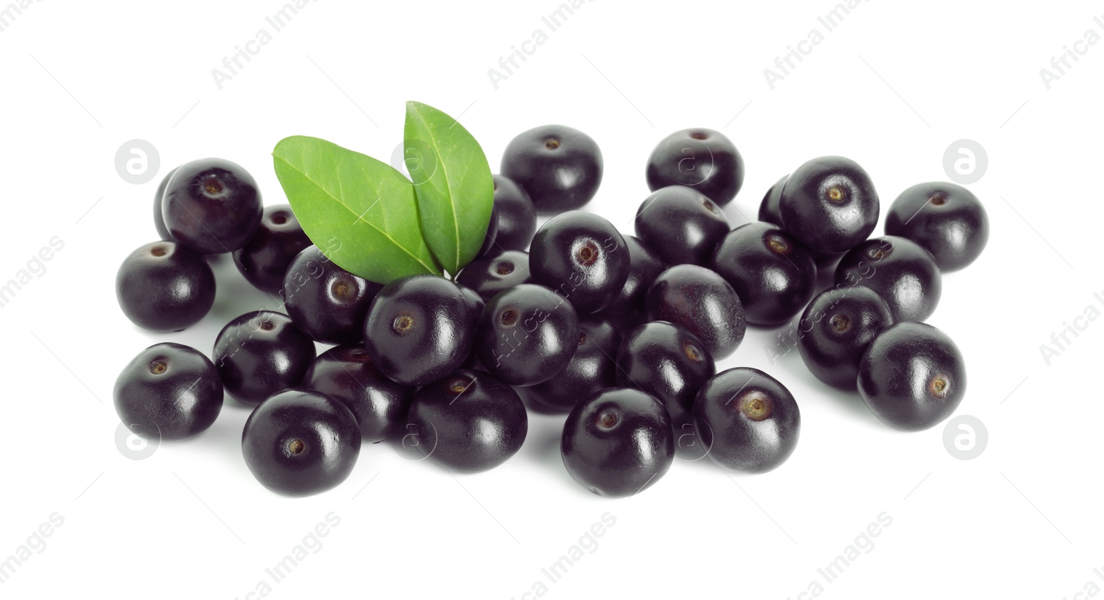 Photo of Fresh ripe acai berries and green leaves isolated on white