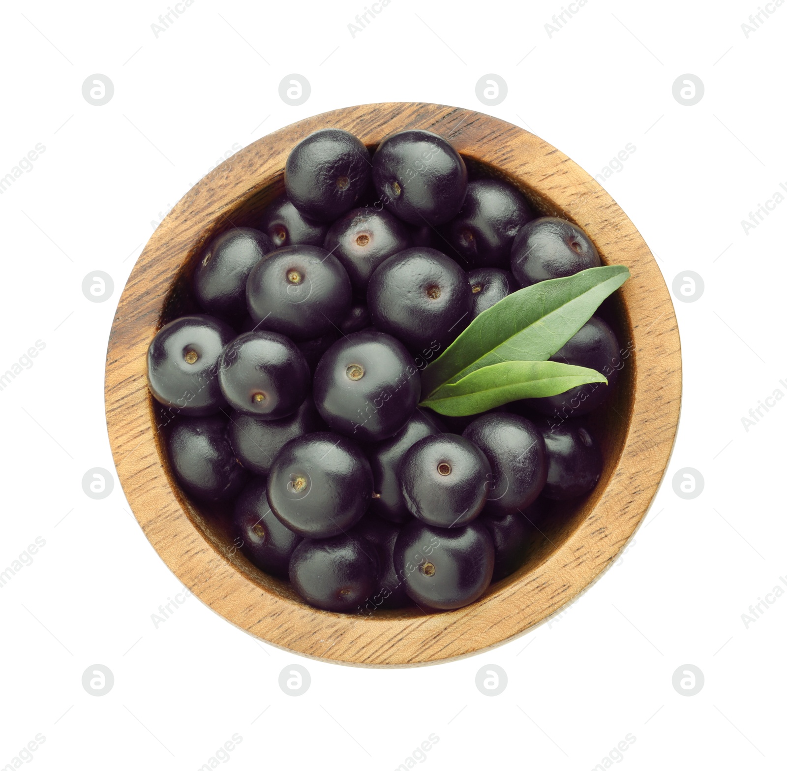 Photo of Fresh ripe acai berries in bowl and green leaves isolated on white, top view