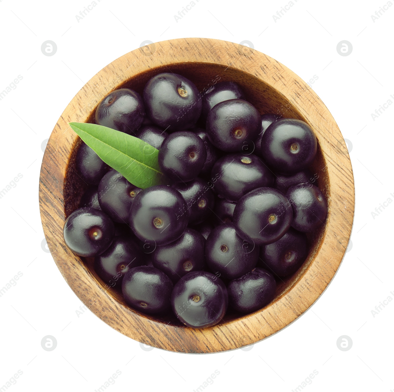 Photo of Fresh ripe acai berries in bowl and green leaf isolated on white, top view