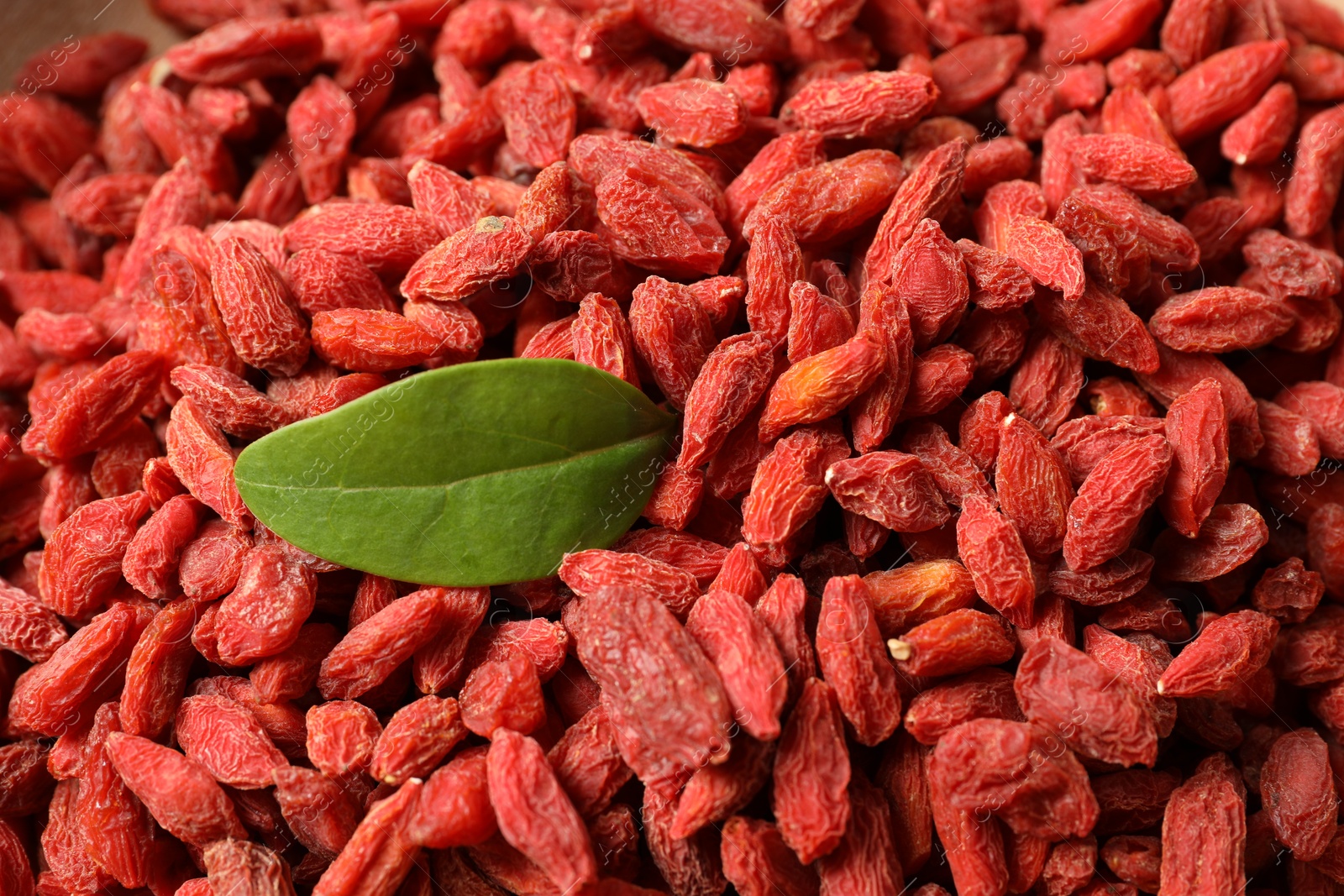 Photo of Dried goji berries as background, closeup view