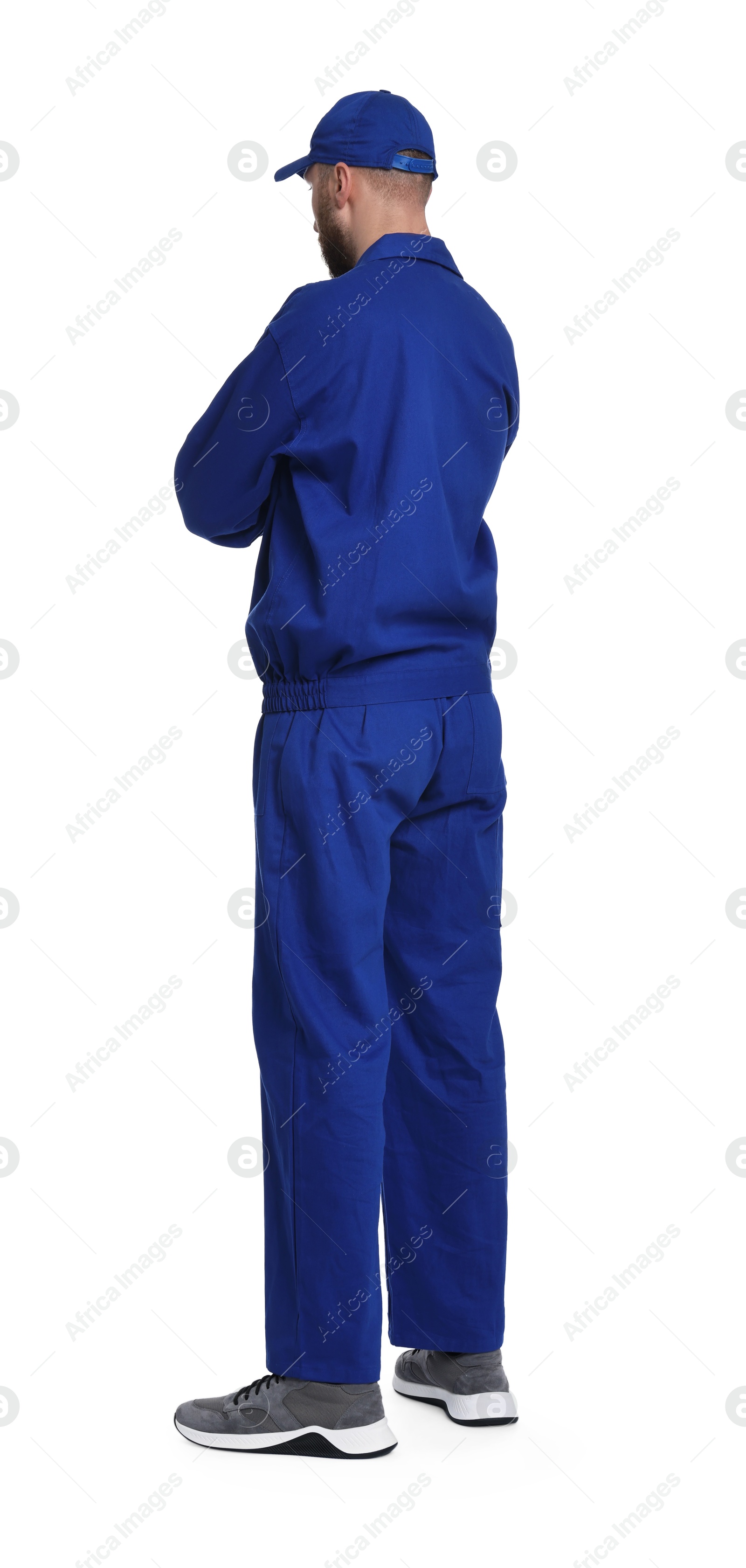 Photo of Professional auto mechanic in blue uniform on white background, back view