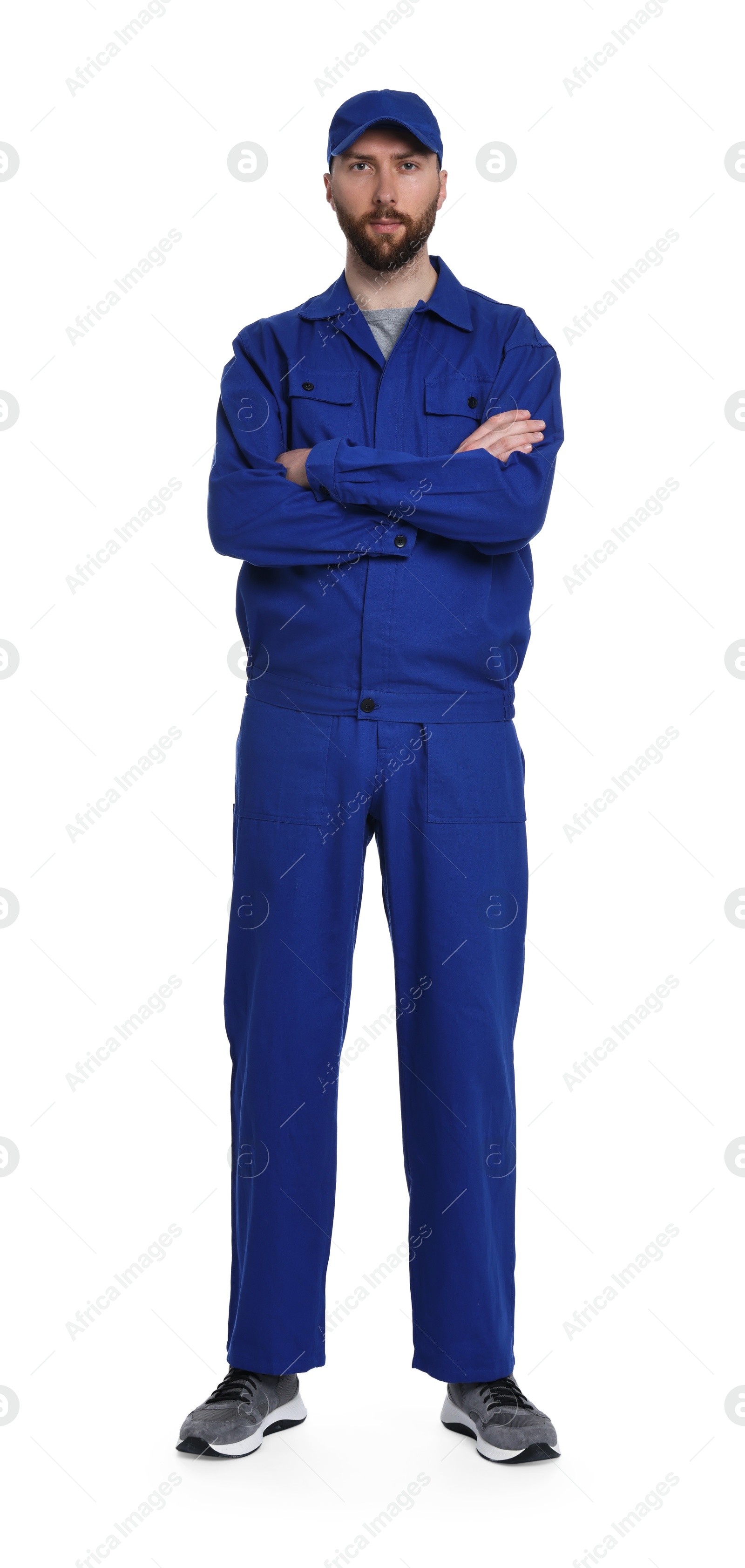 Photo of Professional auto mechanic in blue uniform on white background