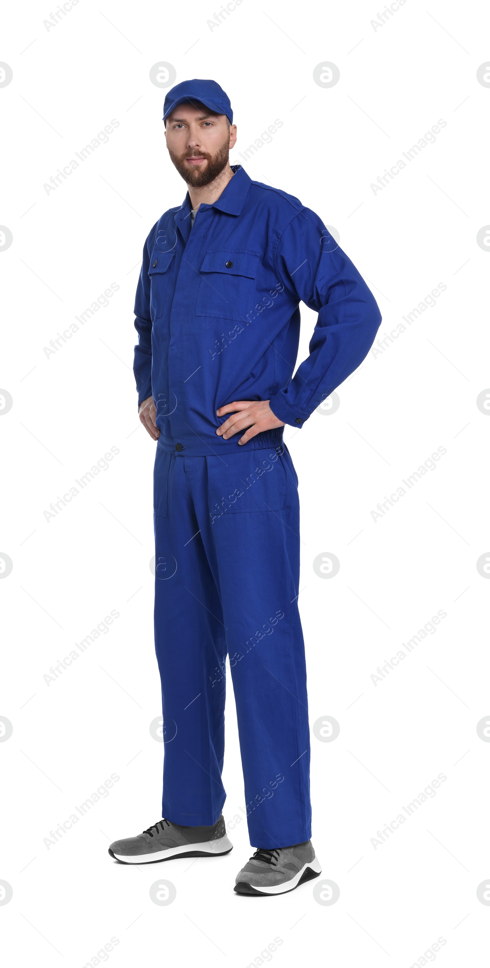 Photo of Professional auto mechanic in blue uniform on white background