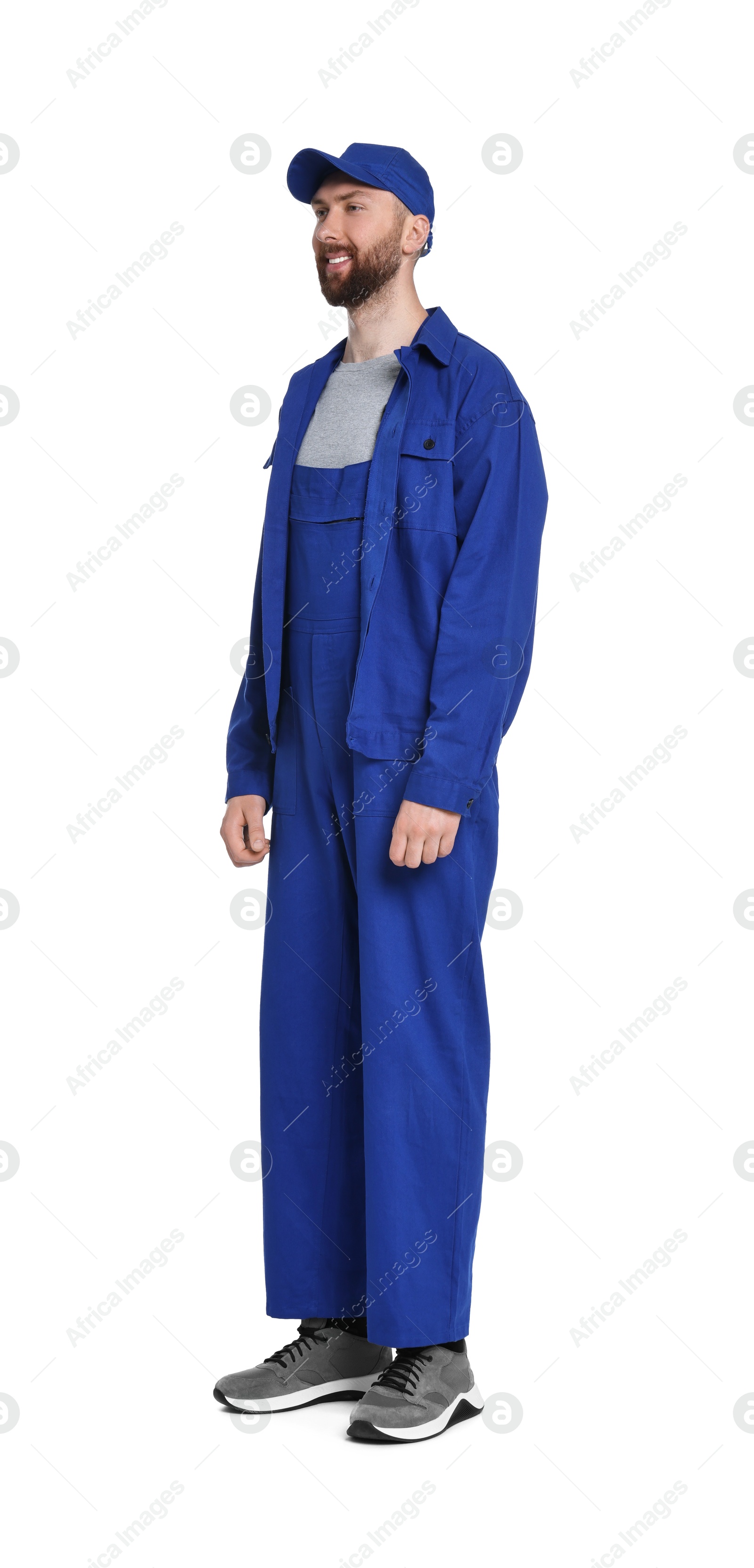 Photo of Professional auto mechanic in blue uniform on white background