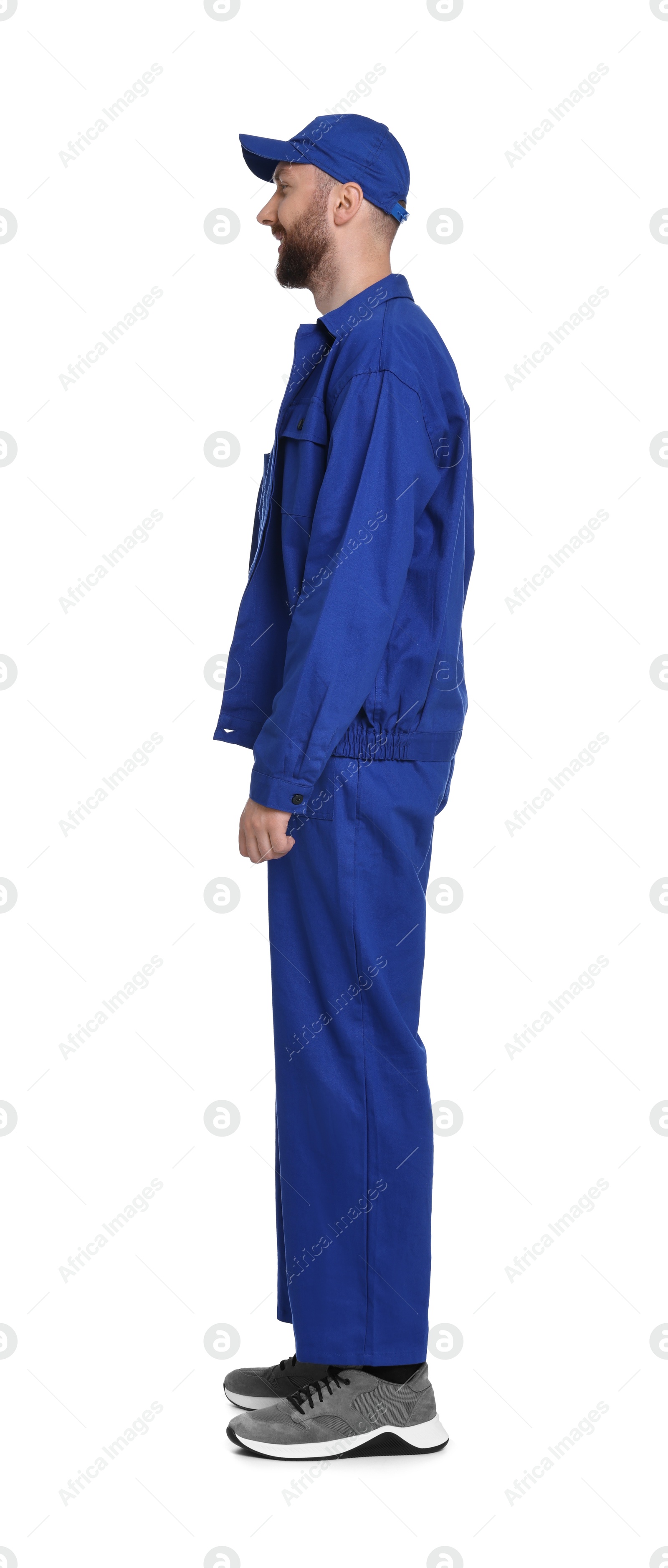 Photo of Professional auto mechanic in blue uniform on white background