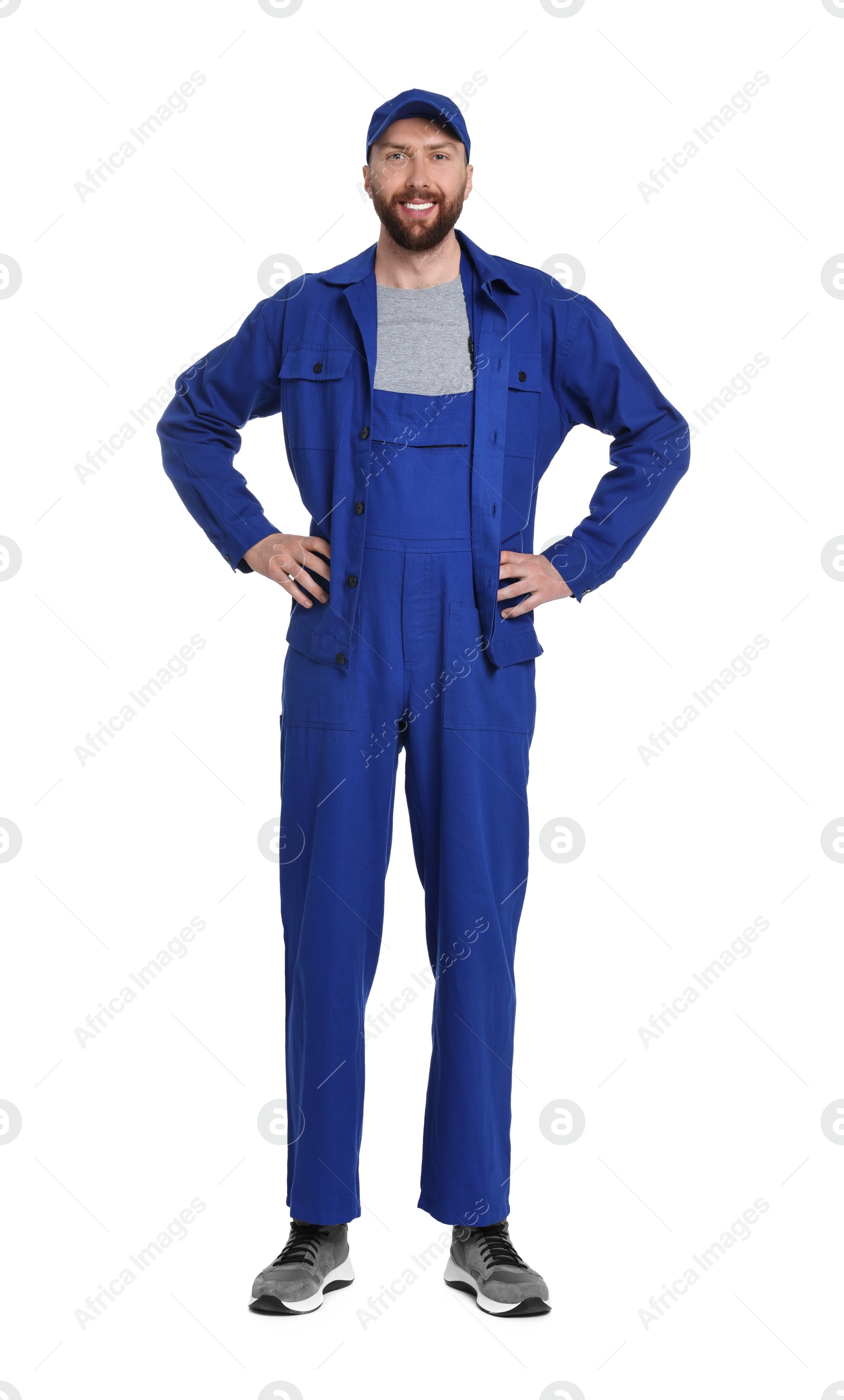 Photo of Professional auto mechanic in blue uniform on white background