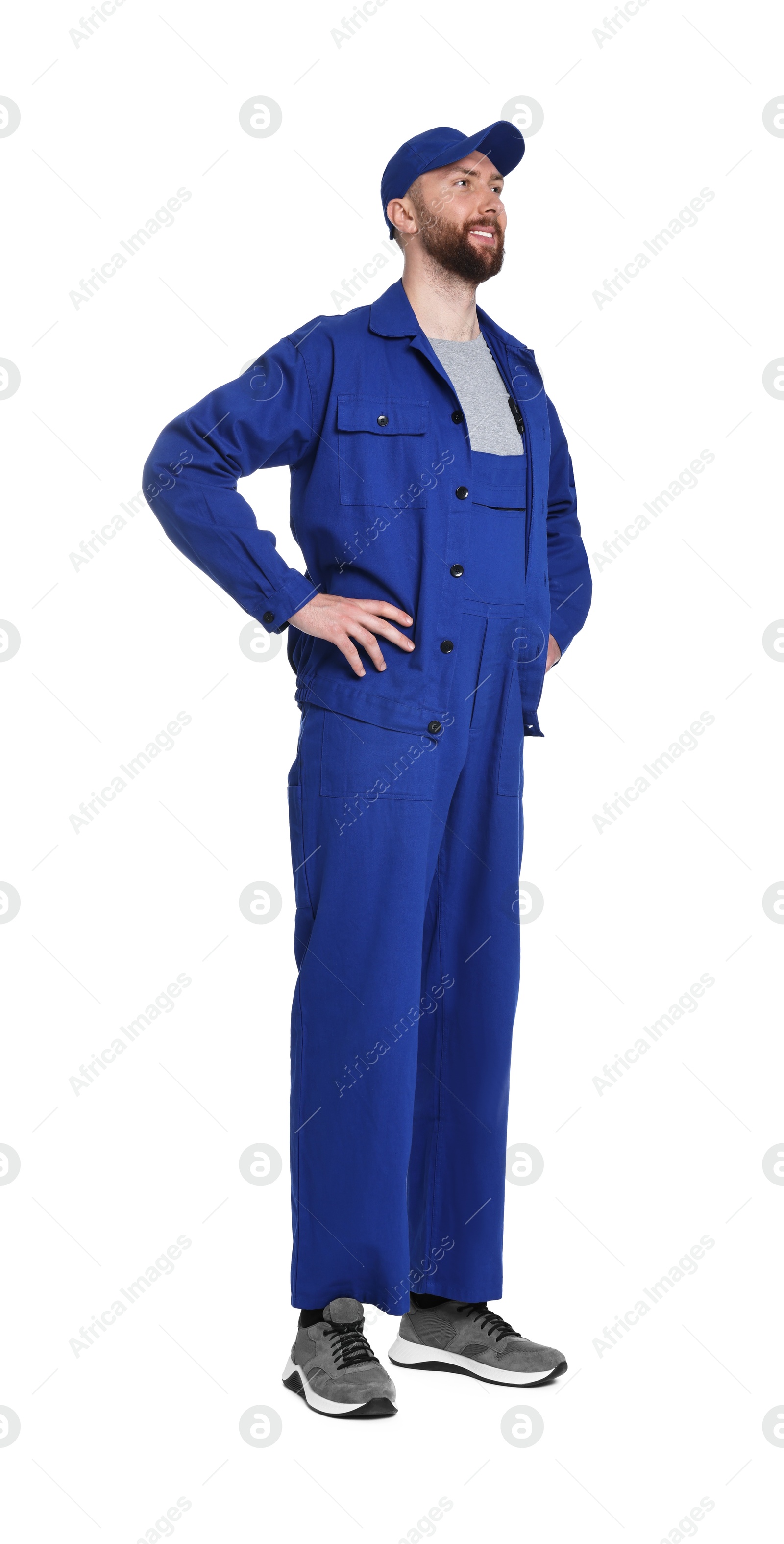 Photo of Professional auto mechanic in blue uniform on white background