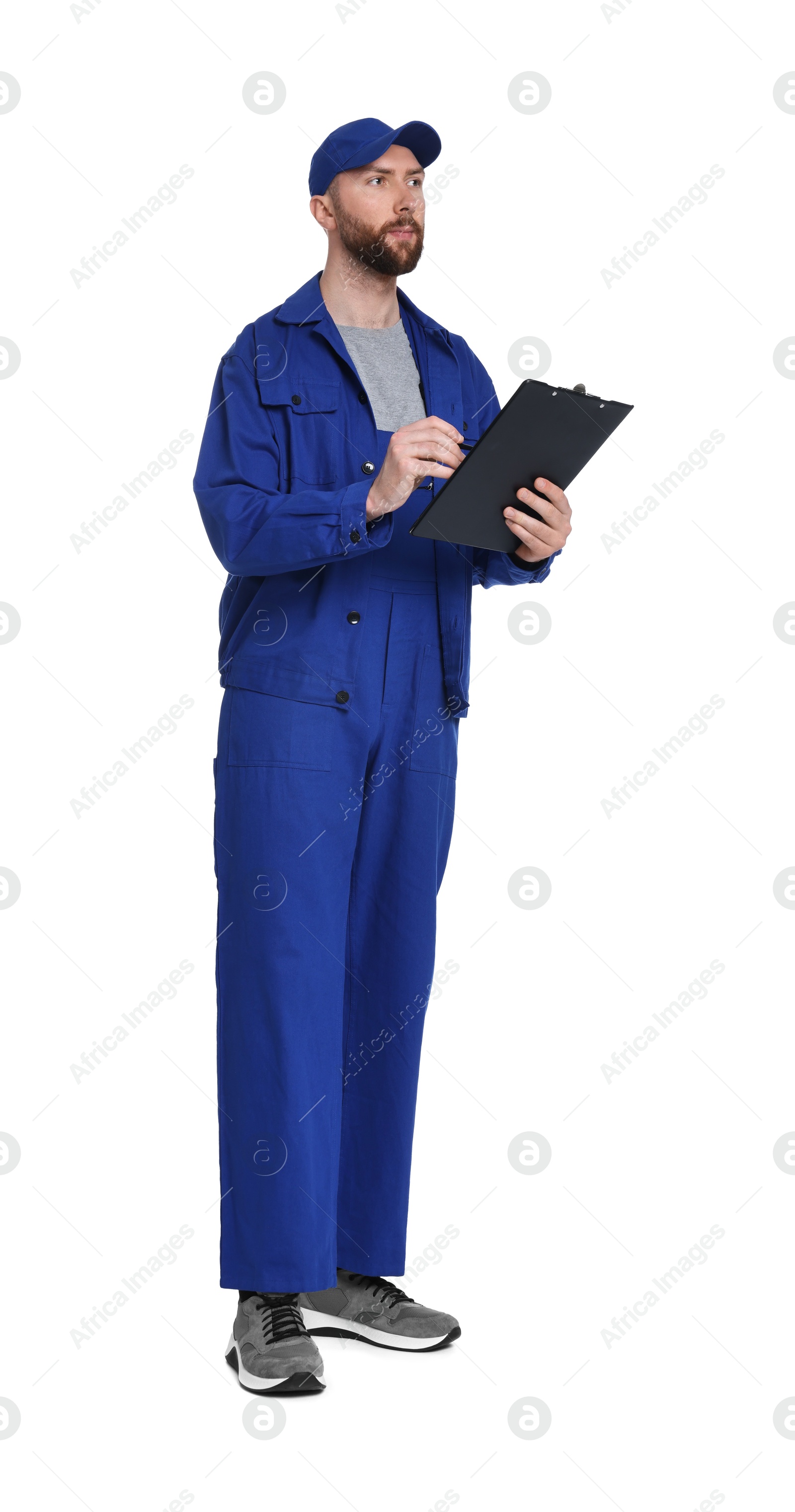 Photo of Professional auto mechanic with clipboard and pen on white background