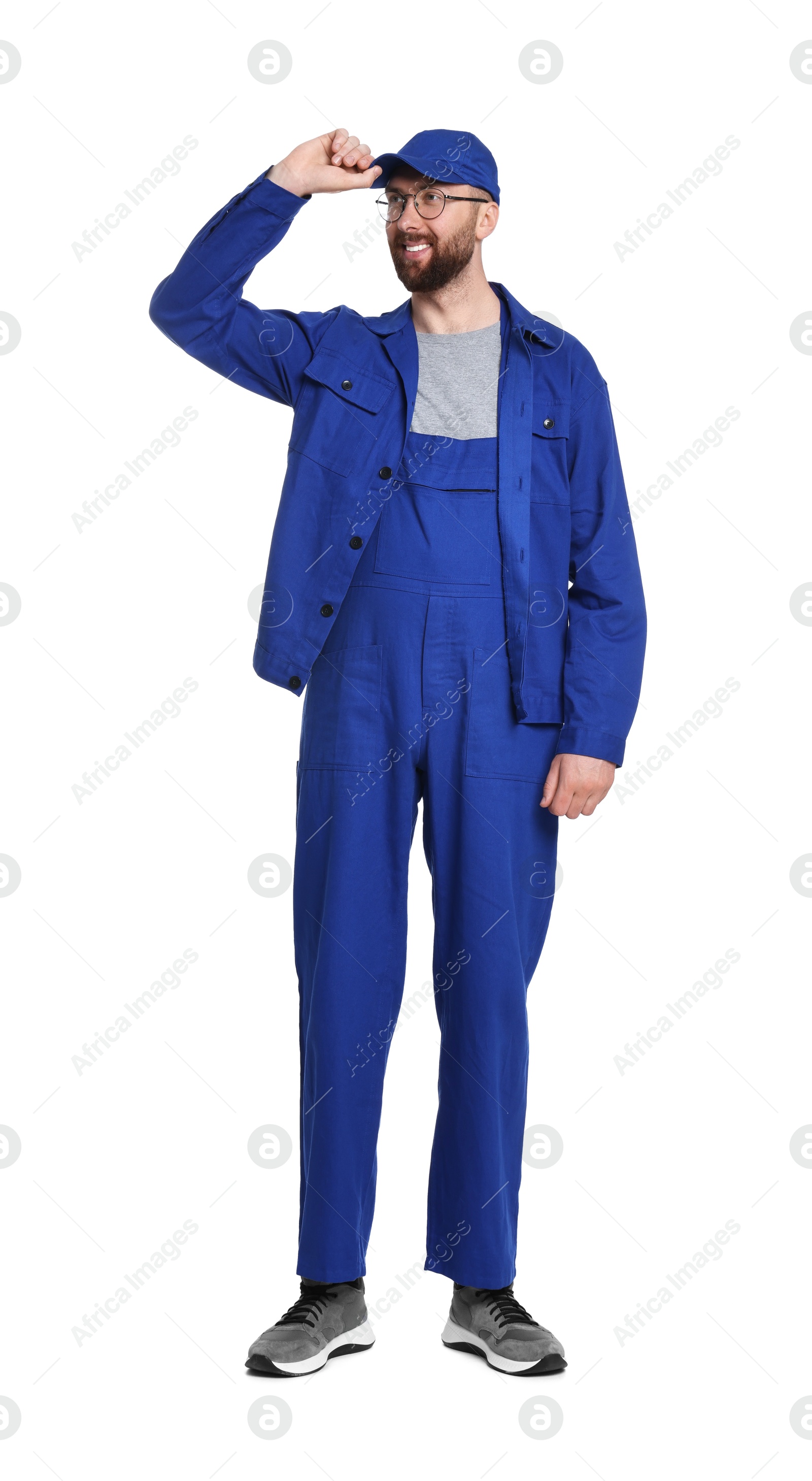 Photo of Professional auto mechanic in blue uniform on white background