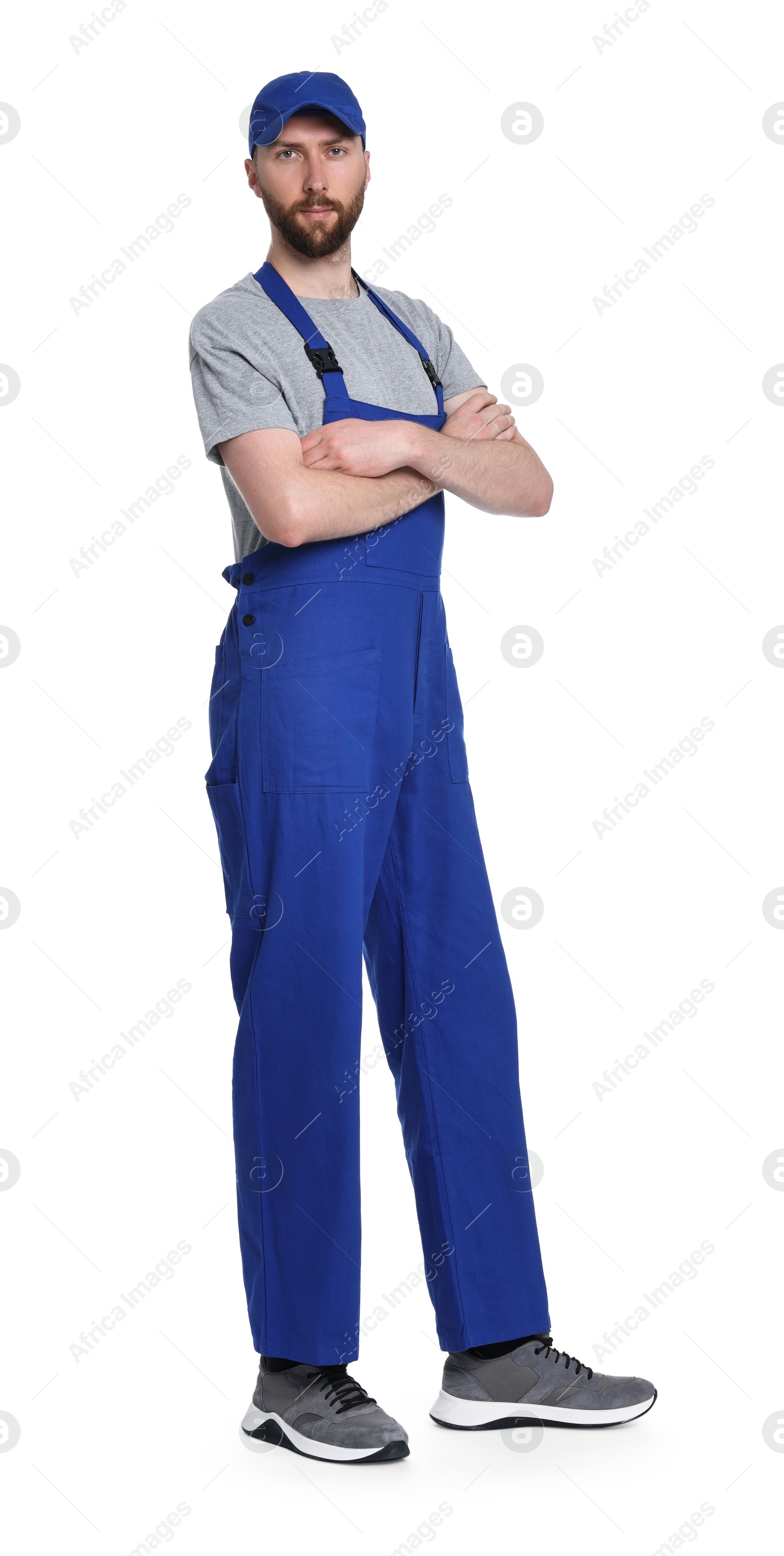 Photo of Professional auto mechanic in uniform on white background