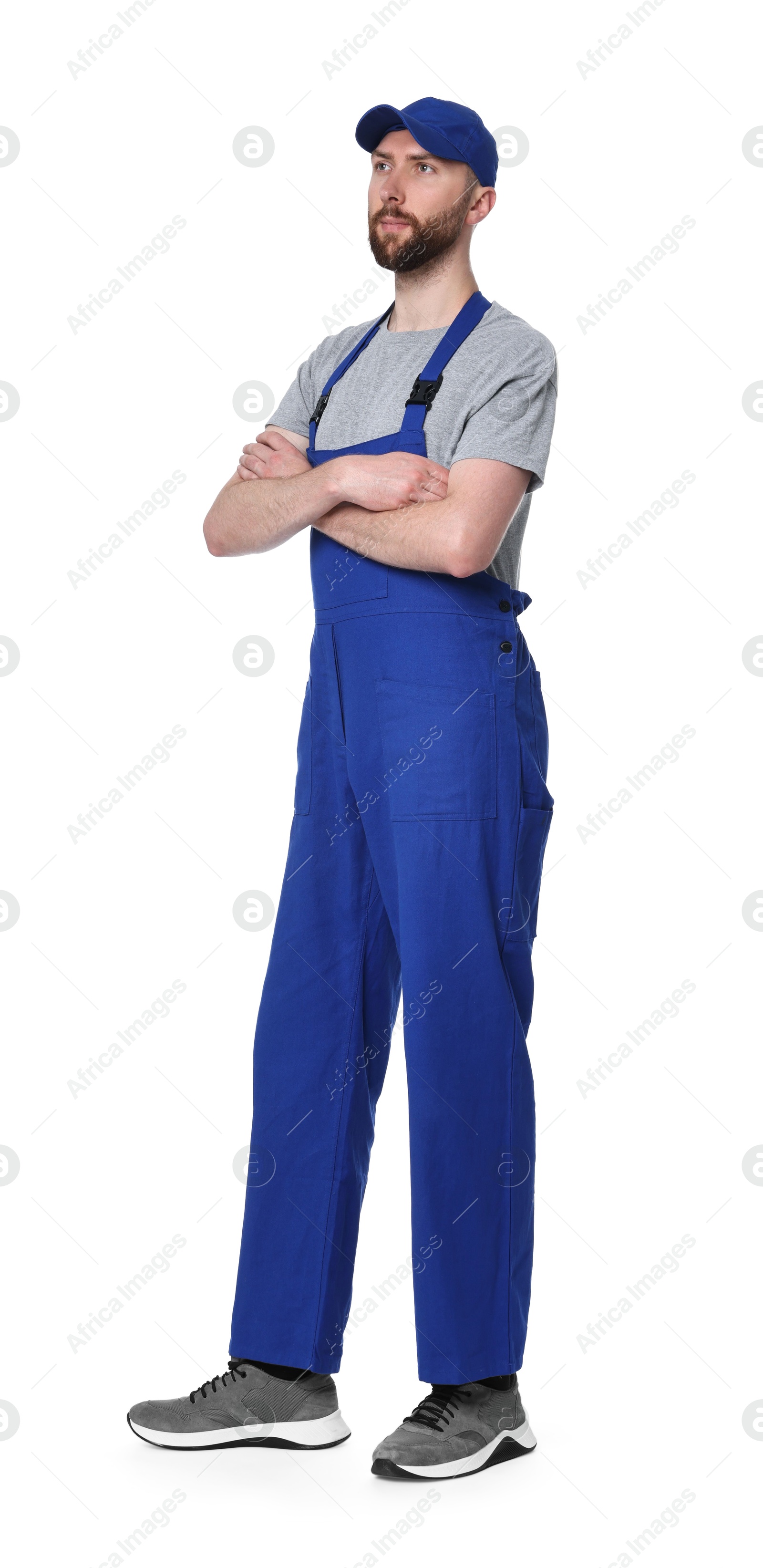 Photo of Professional auto mechanic in uniform on white background
