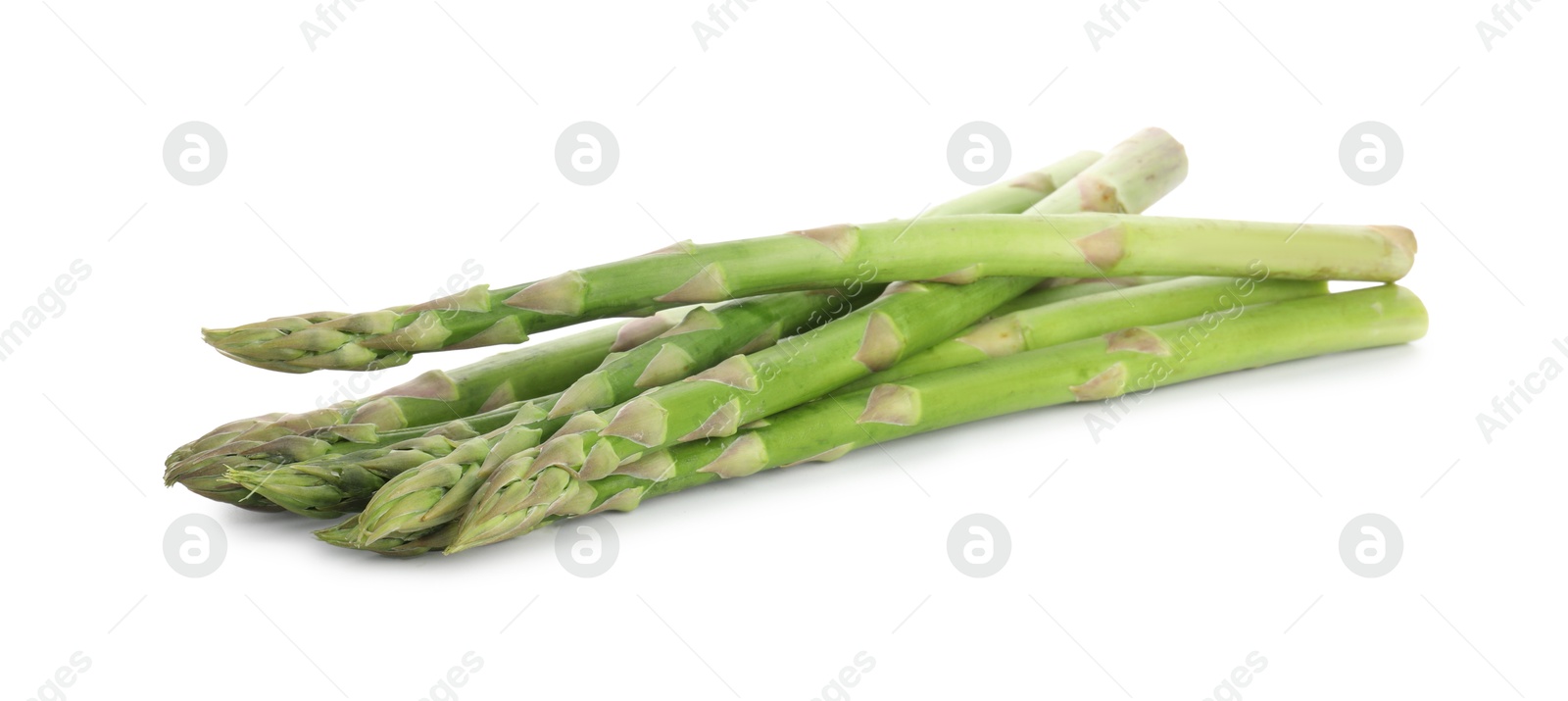 Photo of Fresh green asparagus stems isolated on white