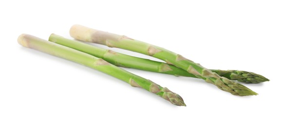 Photo of Fresh green asparagus stems isolated on white