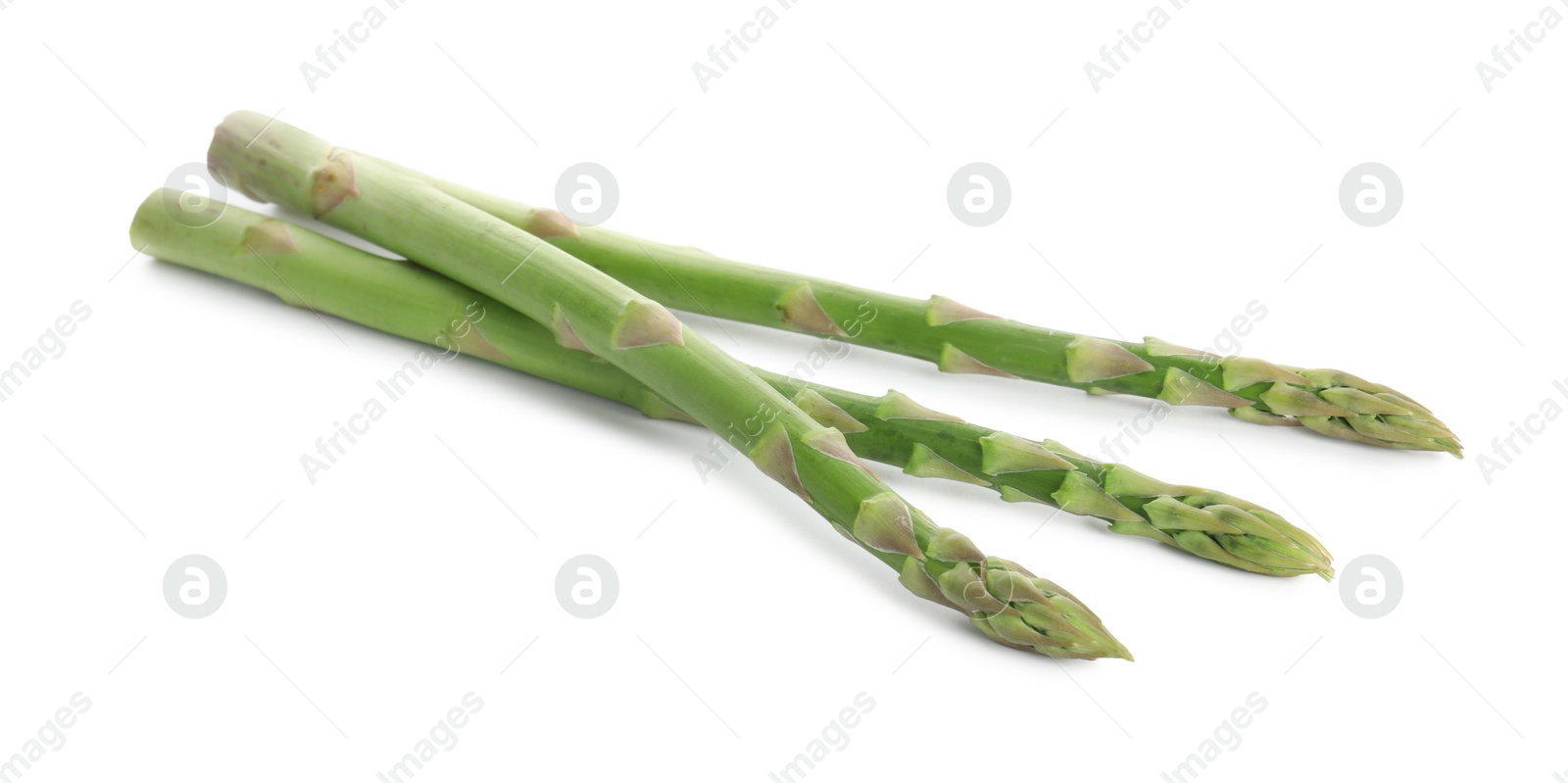 Photo of Fresh green asparagus stems isolated on white