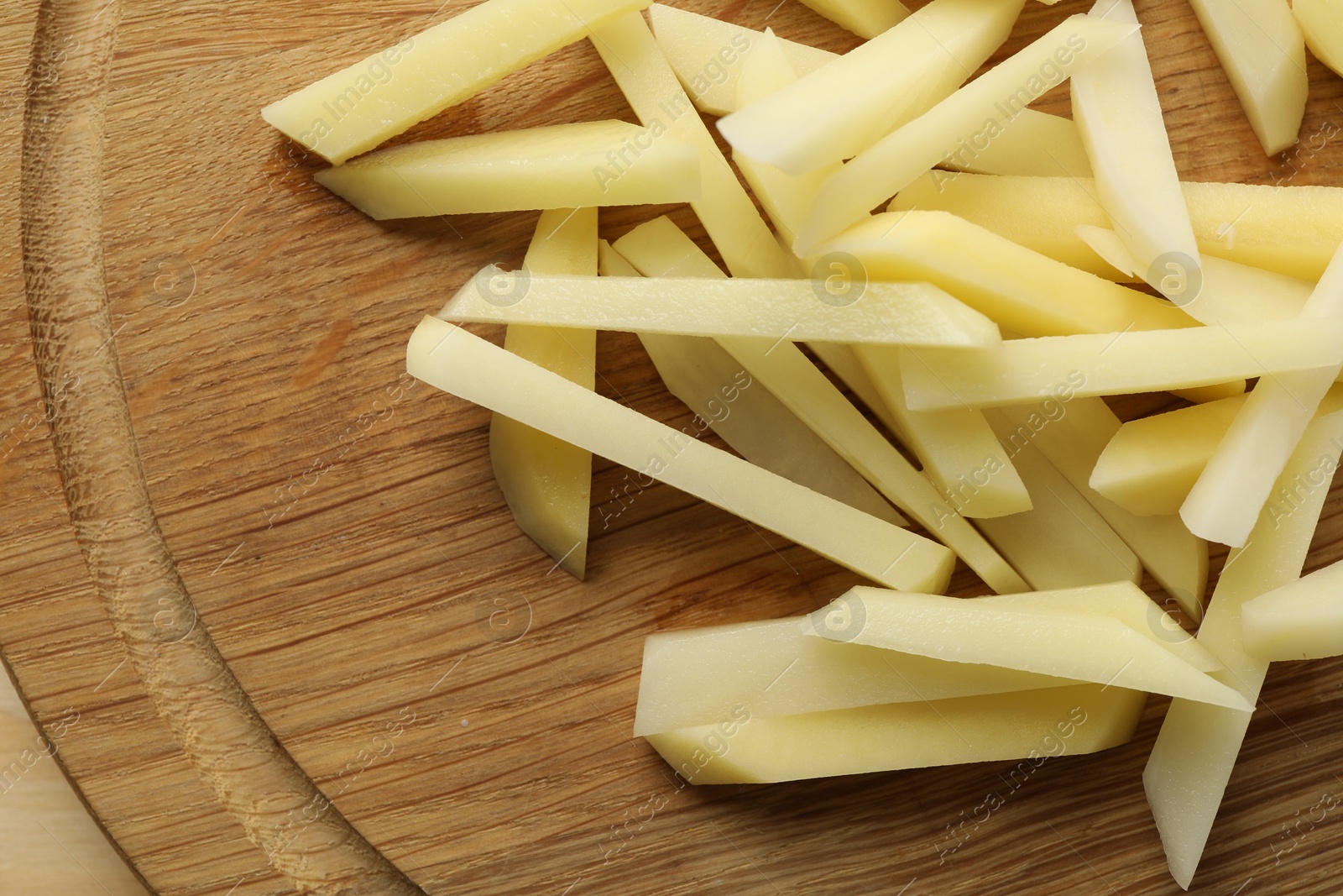 Photo of Cut fresh raw potatoes on table, top view