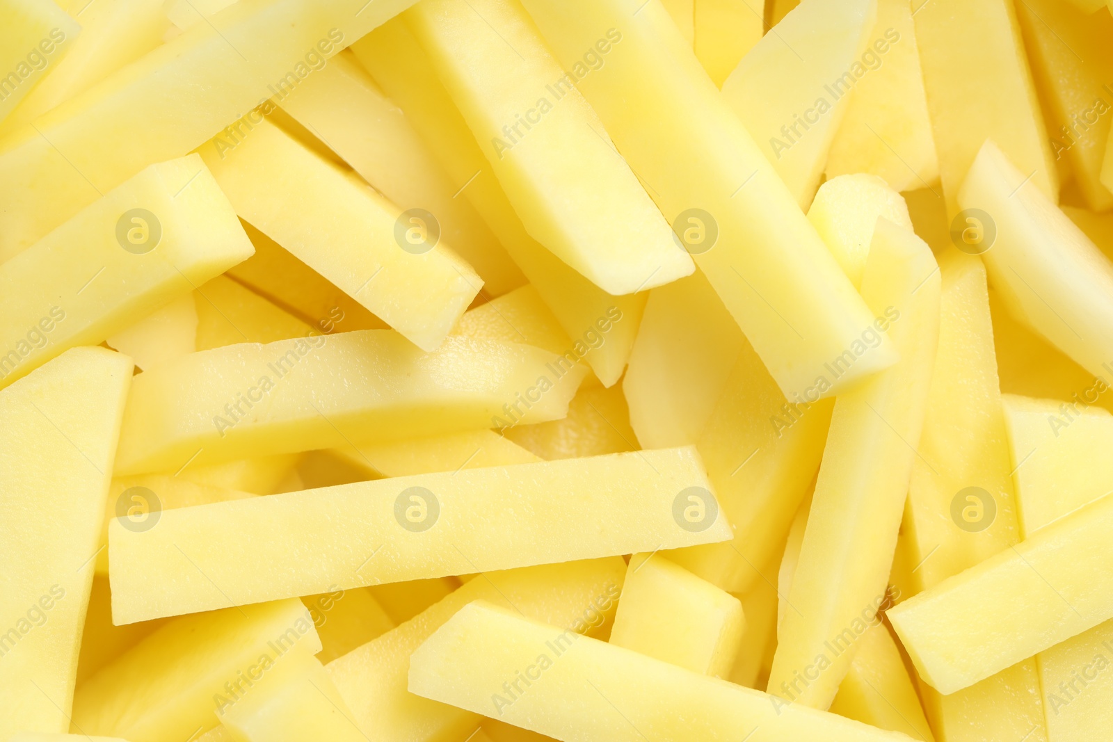 Photo of Cut fresh raw potatoes as background, top view