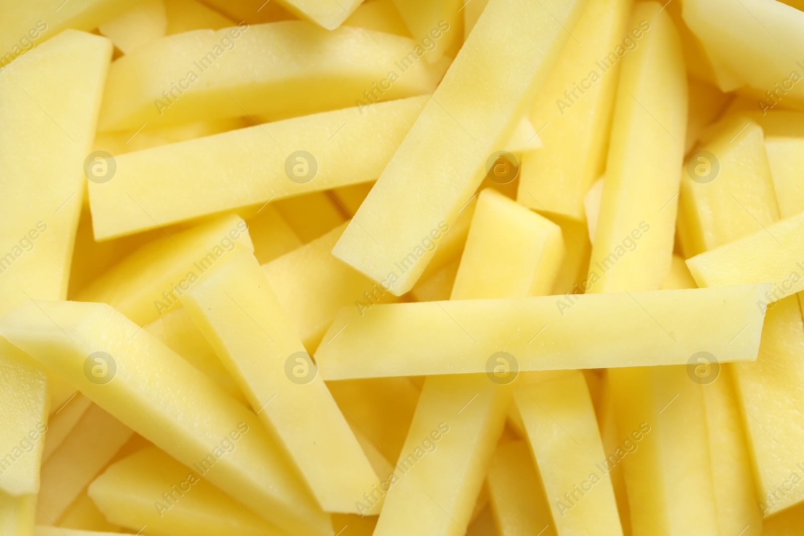 Photo of Cut fresh raw potatoes as background, top view