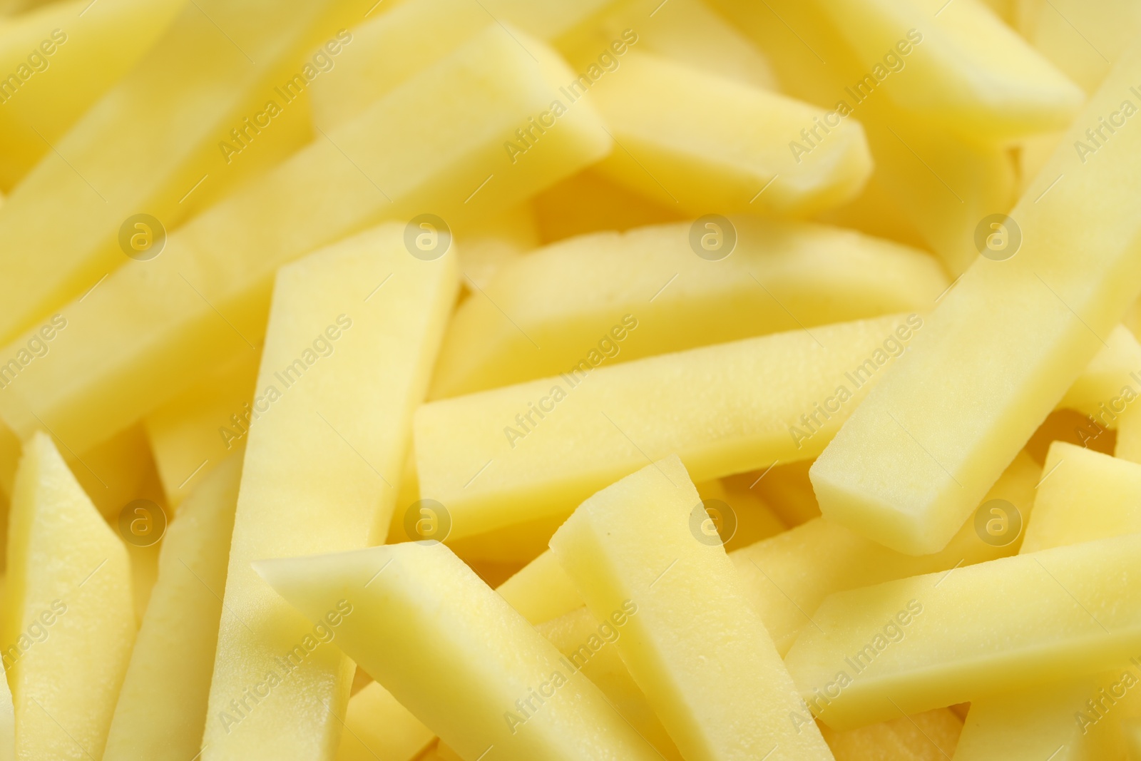 Photo of Cut fresh raw potatoes as background, closeup