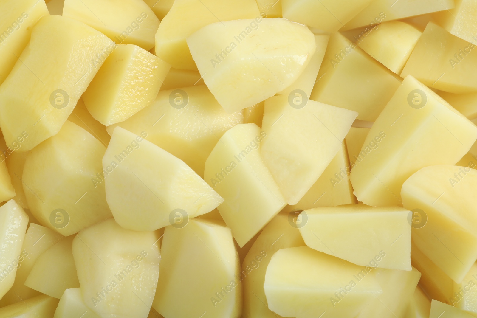 Photo of Peeled fresh raw potatoes as background, top view