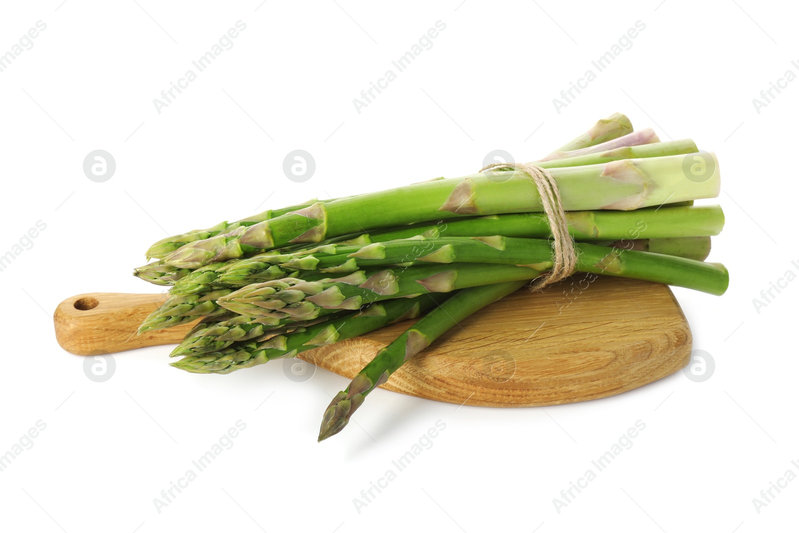 Photo of Board with bunch of fresh green asparagus stems isolated on white