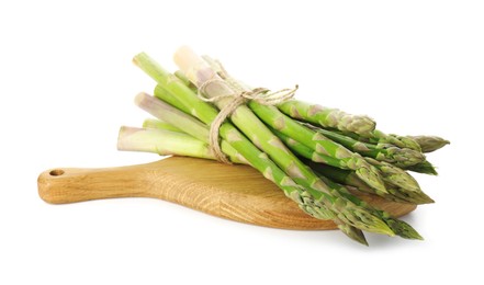 Photo of Board with bunch of fresh green asparagus stems isolated on white