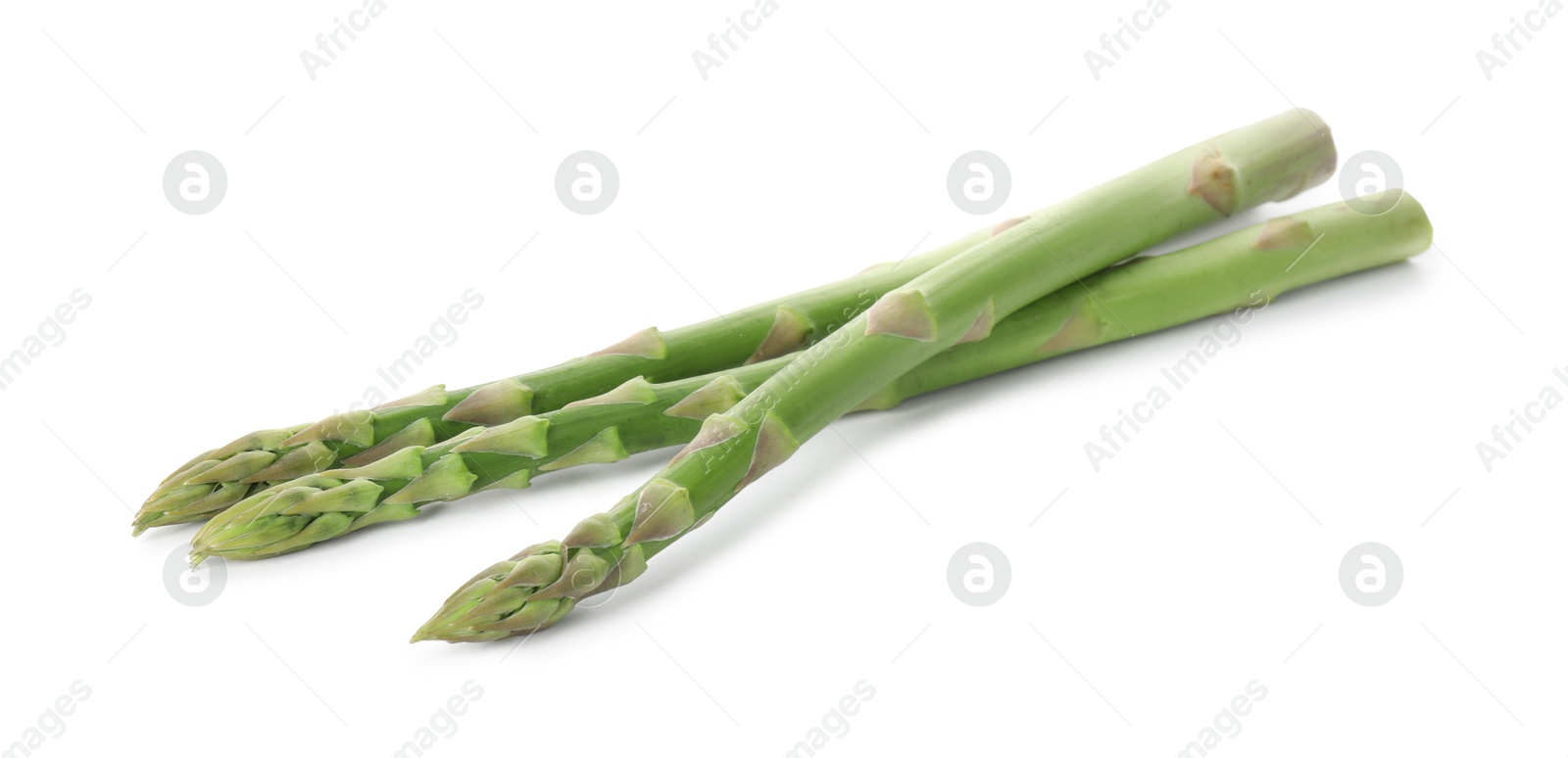 Photo of Fresh green asparagus stems isolated on white