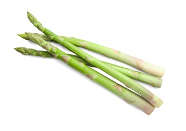 Photo of Fresh green asparagus stems isolated on white, top view