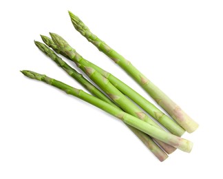 Photo of Fresh green asparagus stems isolated on white, top view