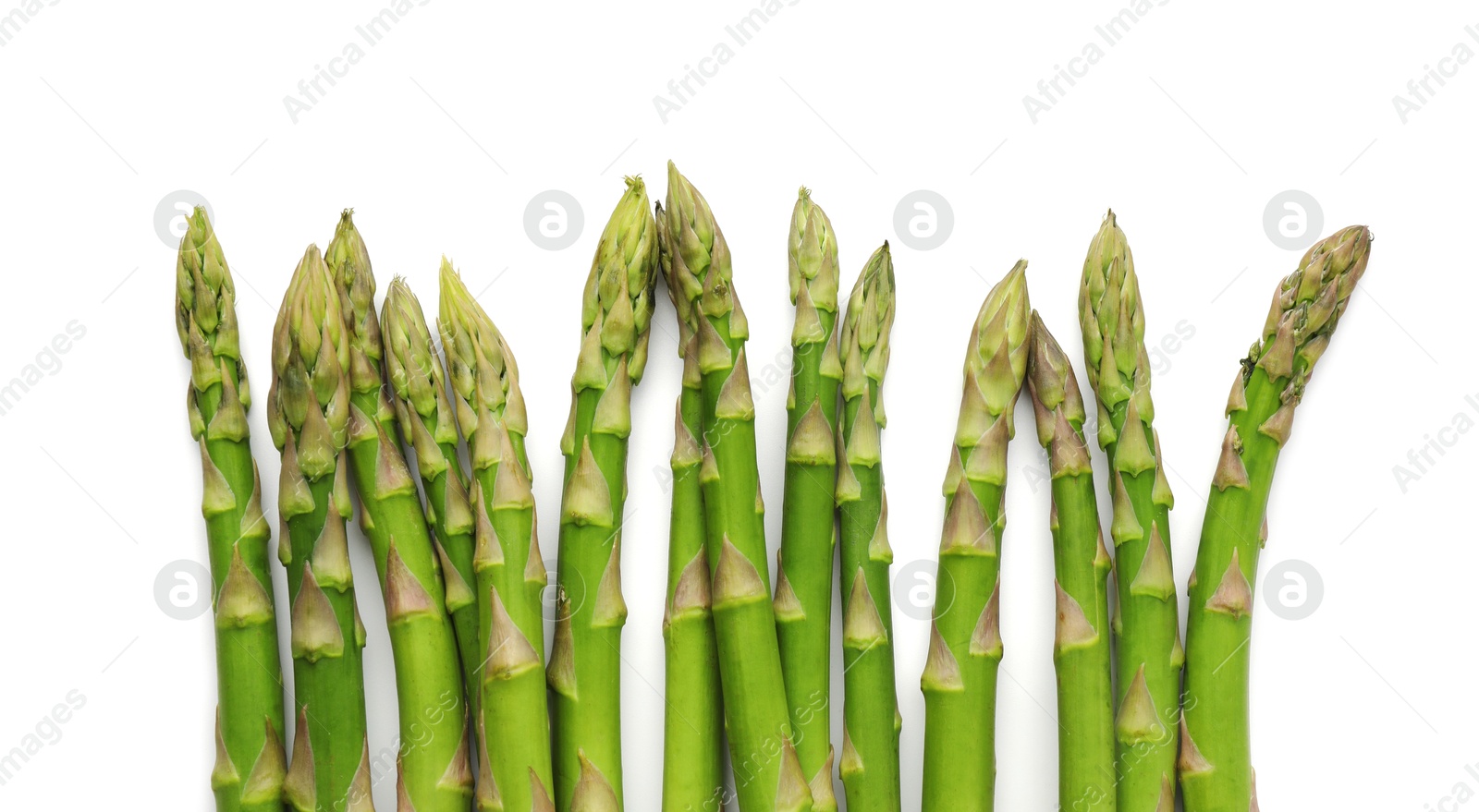 Photo of Fresh green asparagus stems isolated on white, top view