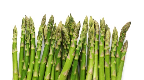 Photo of Fresh green asparagus stems isolated on white, top view