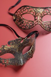 Photo of Two beautiful carnival masks on red background