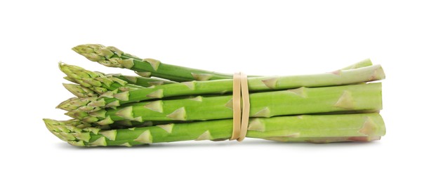 Photo of Many fresh green asparagus stems isolated on white